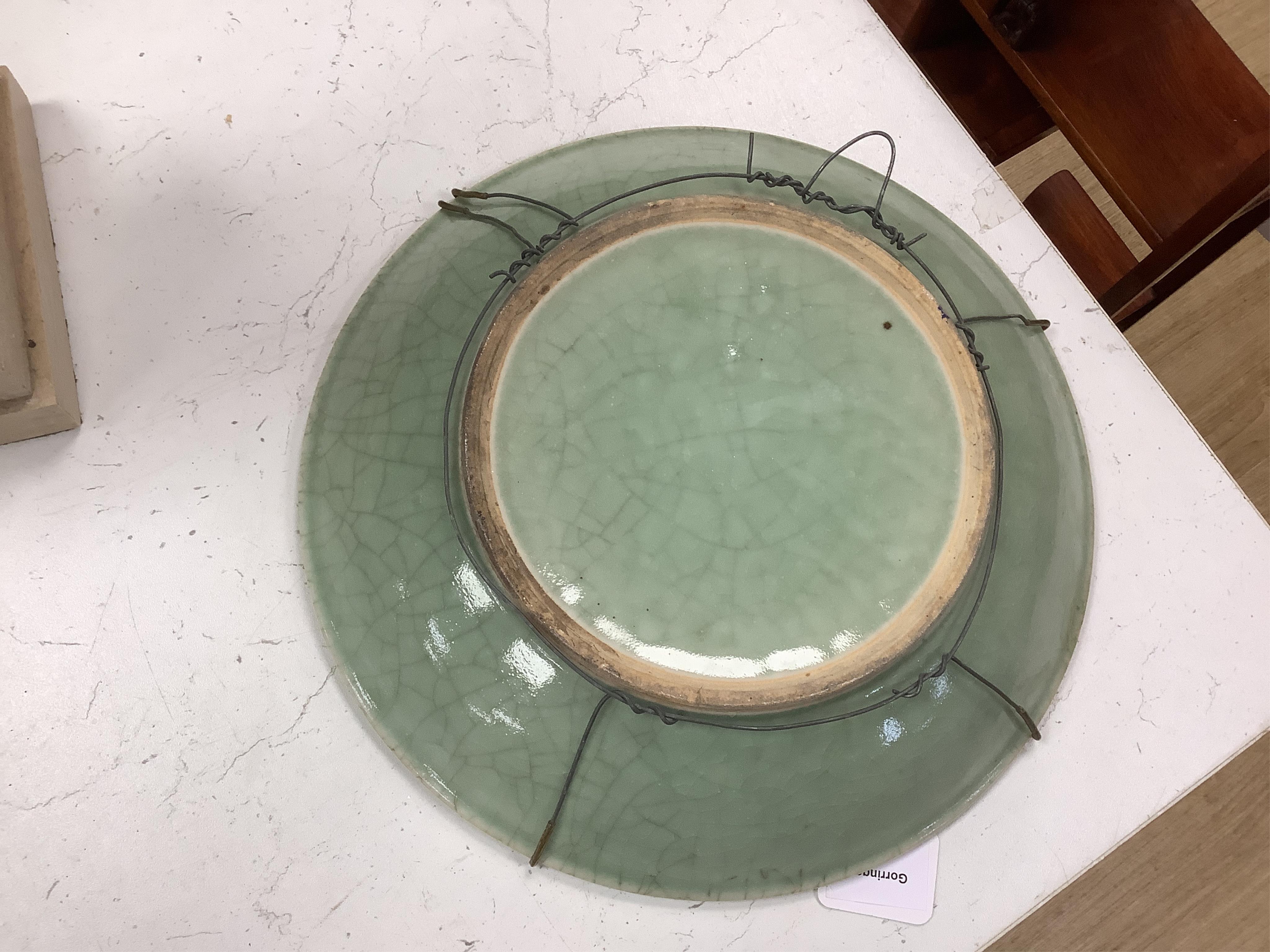 A Chinese celadon glazed dish, late Qing, 34cm in diameter